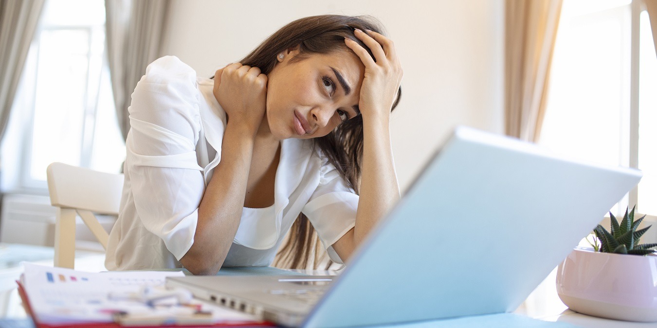 Young Frustrated Woman Working From Home Office In Front Of Laptop Suffering From Chronic Daily Headaches, Treatment Online, Appointing To A Medical Consultation, Electromagnetic Radiation, Sick Pay
