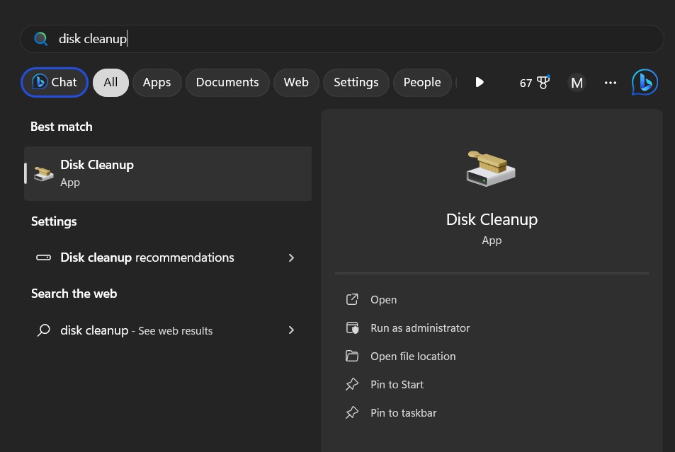 Typing "disk cleanup" in Windows Search. 