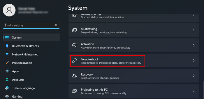 Clicking on "Troubleshoot" option under System in Settings.