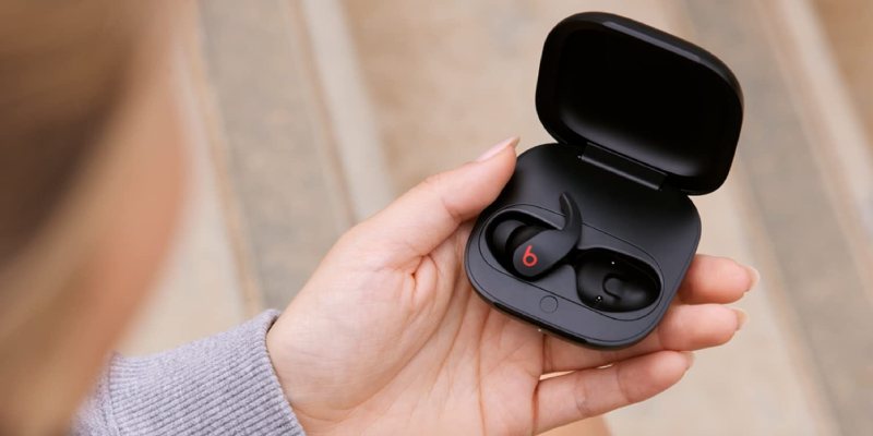 Woman Holding Beats Fit 2