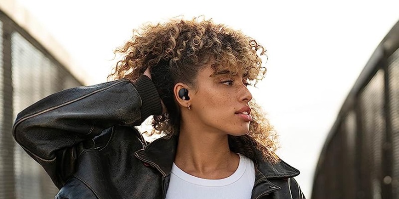 Woman Listening to Sony Earbuds