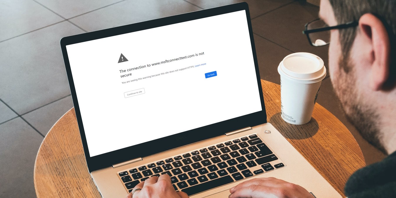 Man On Laptop With Browser Showing Error