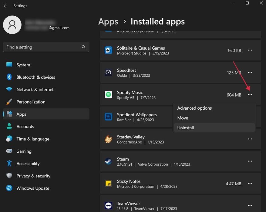 Clicking on three-dots next to Spotify Music app in Installed Apps. 