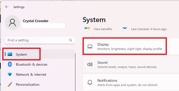 Clicking on "Display" under "System" in Windows Settings.