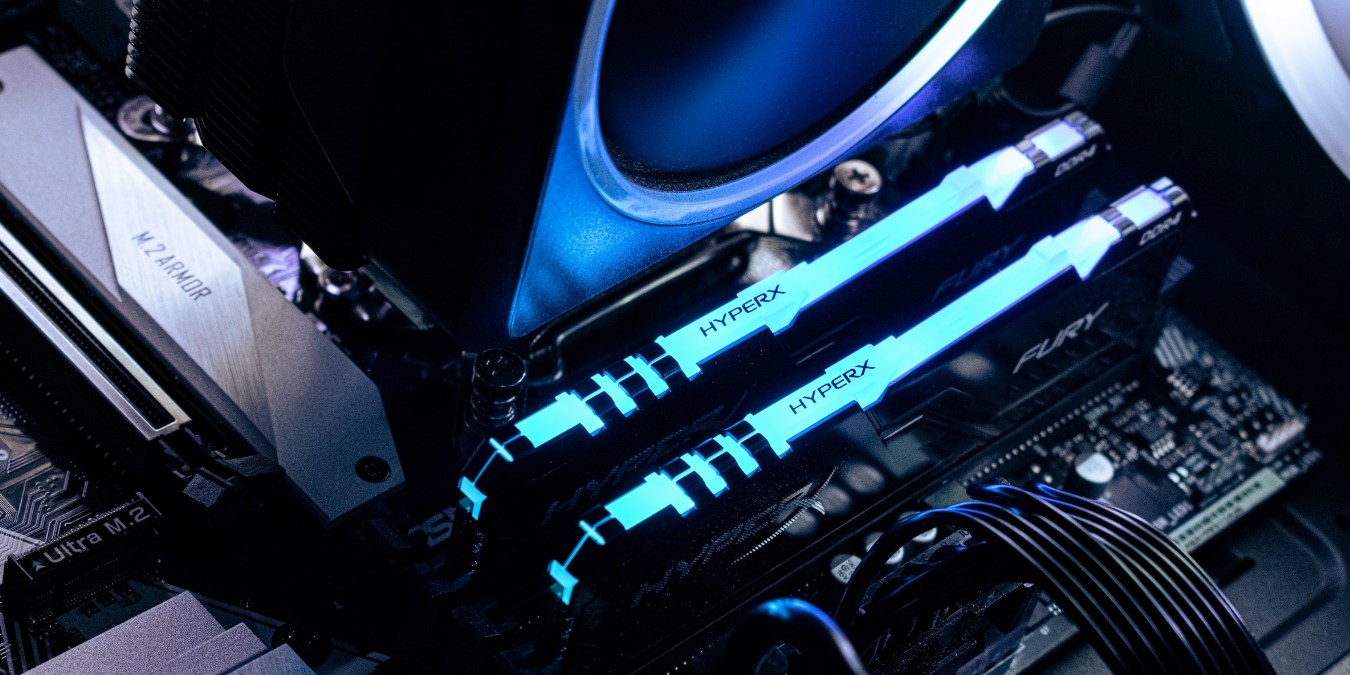 Close up of RAM sticks on a motherboard in blue lighting