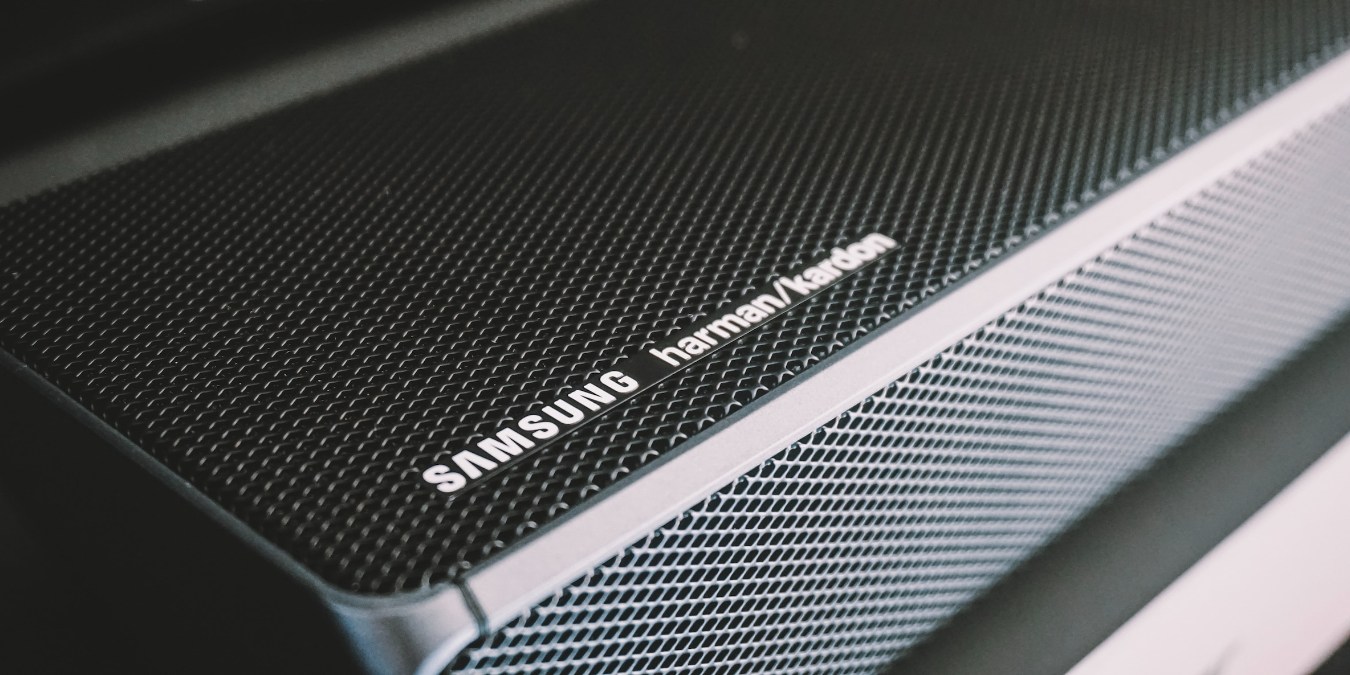 Close up of a black Samsung soundbar with Samsung and Harman Kardon logos