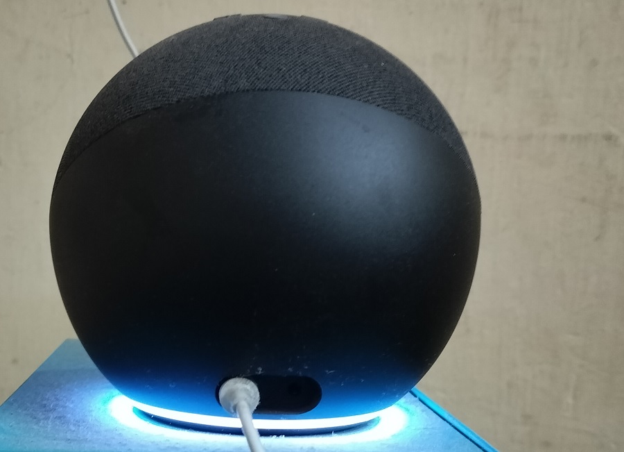 Alexa displaying a white light, indicating speaker volume is being increased or decreased.