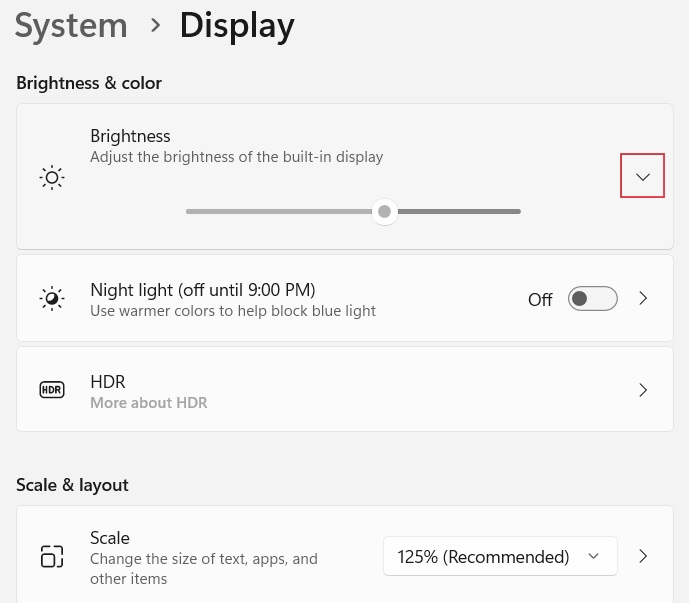 Clicking the downwards arrow next to the Brightness slider.