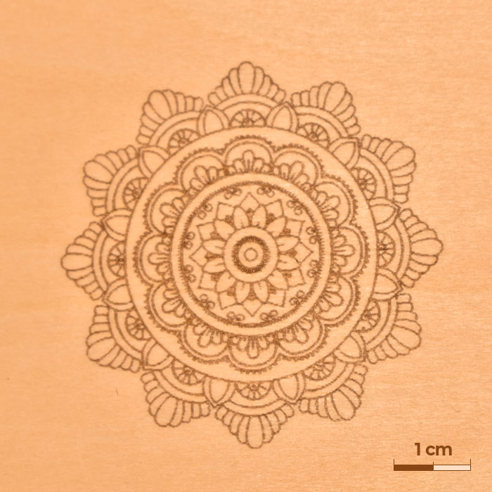 Wood engraving showing a detailed mandala.