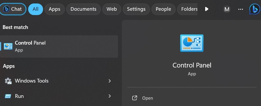 Typing Control Panel in the Windows Search bar.