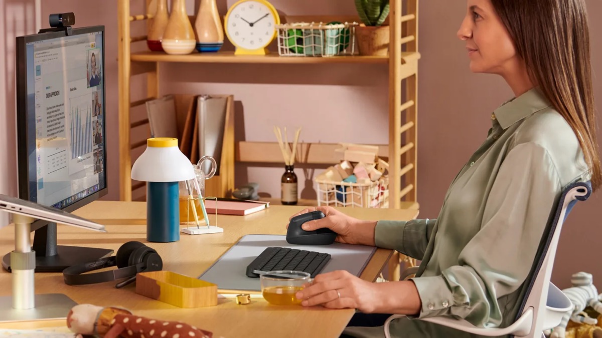 Woman Using Logitech Ergonomic Mouse for Carpel Tunnel