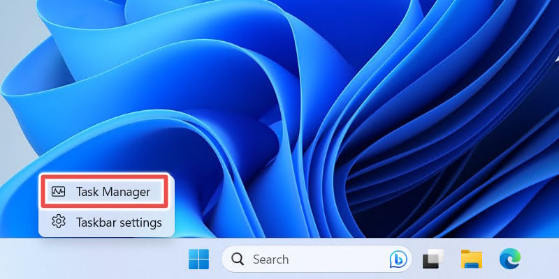 Opening Task Manager from the taskbar.