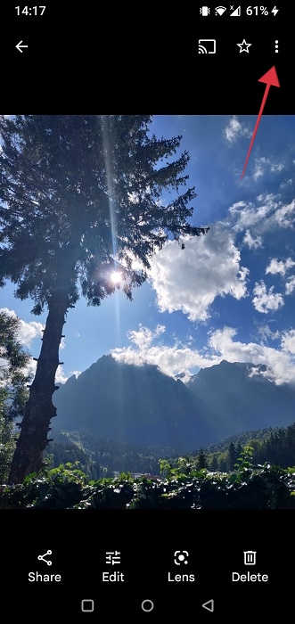 Tapping three-dots in the upper right corner of photo on Google Photos app.