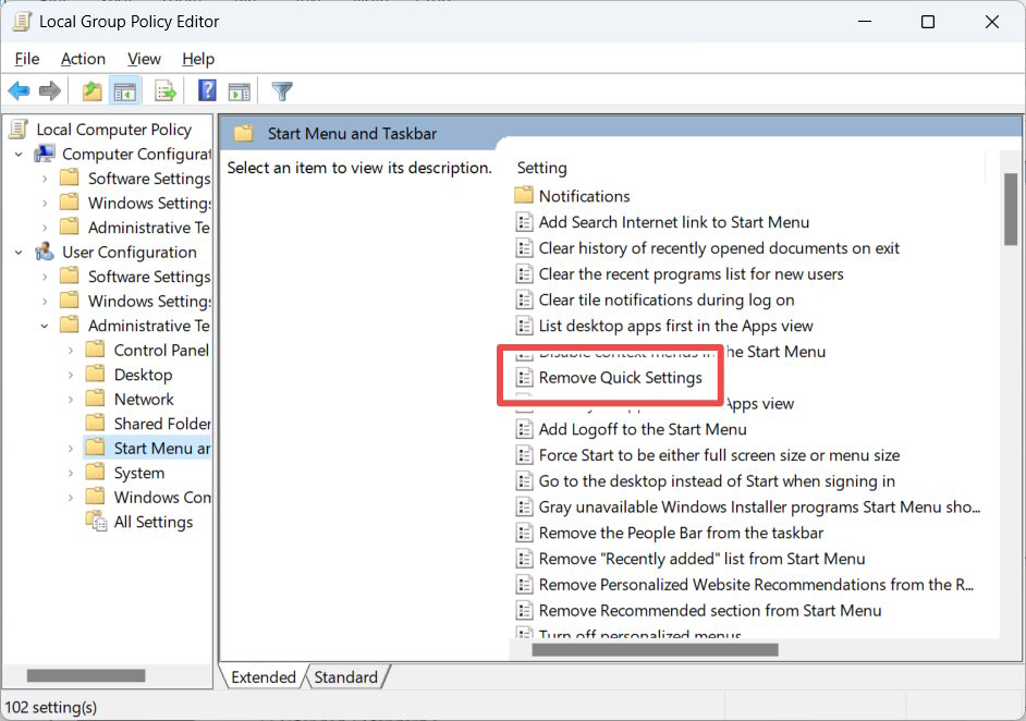Clicking on "Remove Quick Settings" policy in the Local Group Policy Editor.
