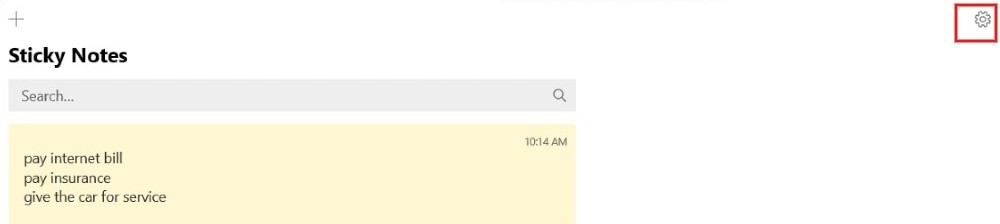 Pressing gear icon in Sticky Notes app. 