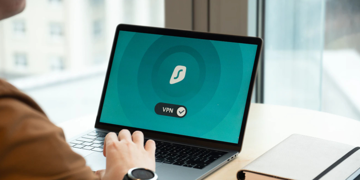 A person using a VPN on a laptop.