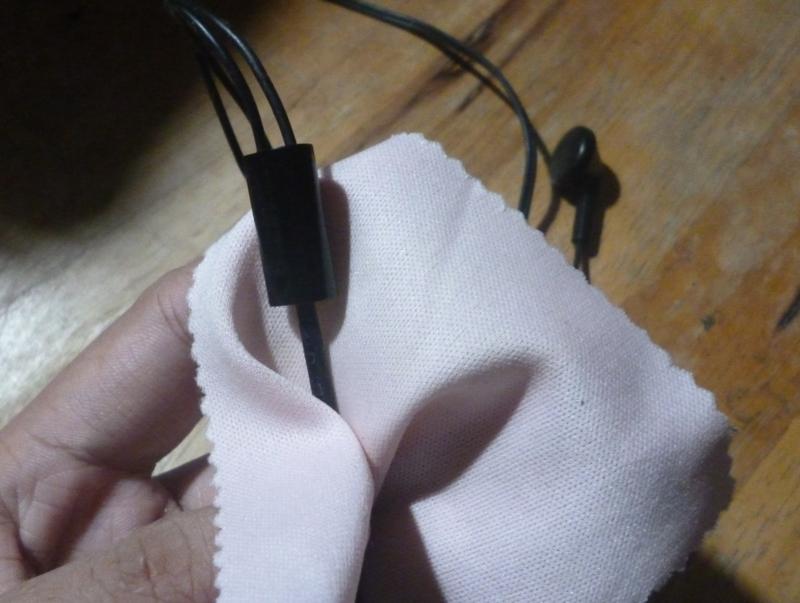 Wiping Earphone Cable With Pink Cloth