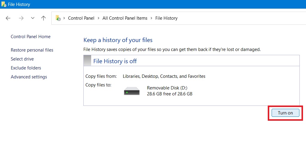 Clicking "Turn on" in Control Panel File History.