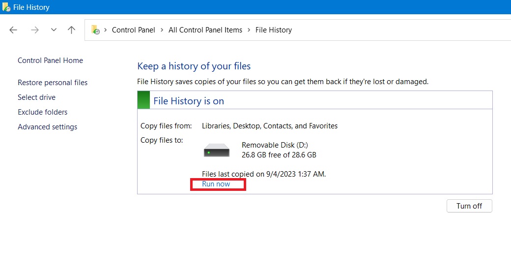 Clicking "Run now" in File History to start a backup operation.