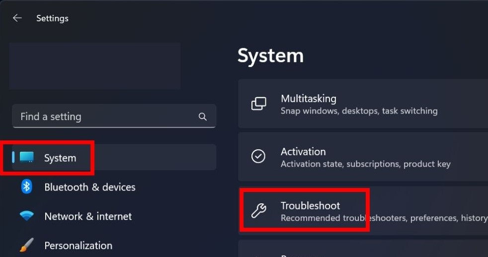 Navigating to System Settings in Windows and selecting Troubleshoot.