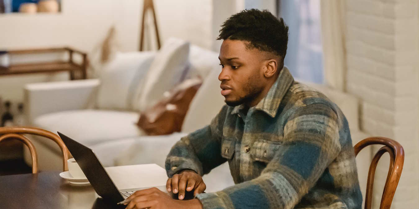 A Man Using A Computer