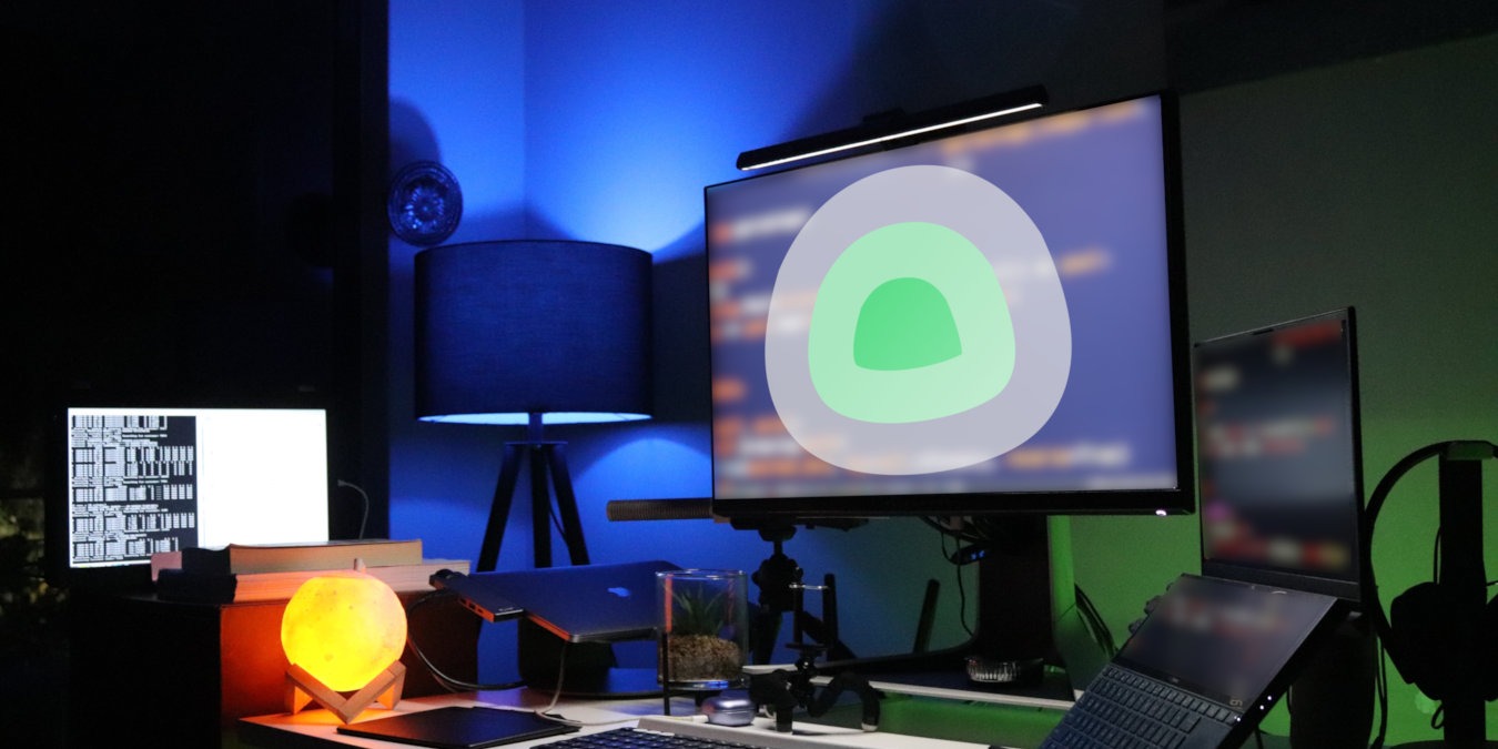 A photograph of a desk filled with computers.