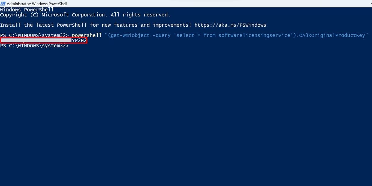 PowerShell command line showing a Windows product key.