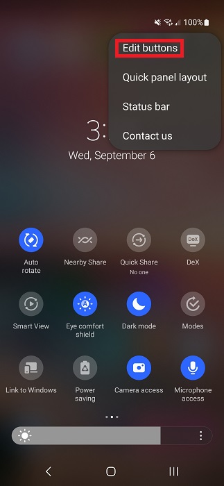 Tapping on "Edit buttons" options in Quick Settings.