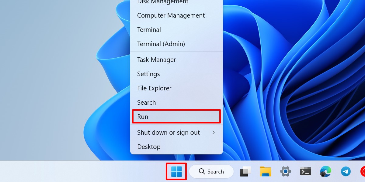 Opening the Run utility from the WinX menu.