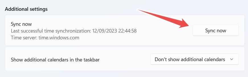 Pressing the "Sync now" button for time settings on Windows.