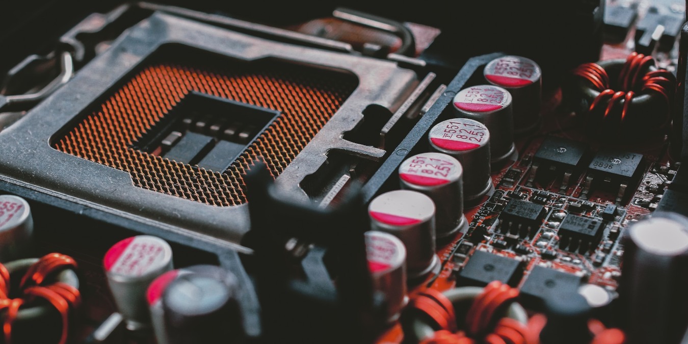Close up of a PC motherboard showing VRM and CPU socket