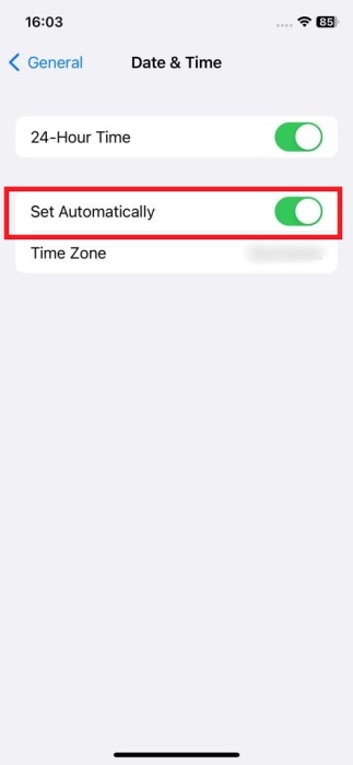 Enabling "Set Automatically" toggle in iOS Settings.