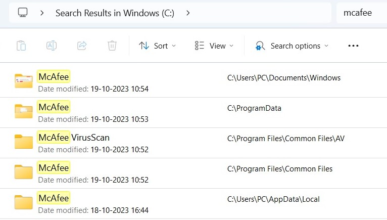 McAfee results shown in File Explorer.