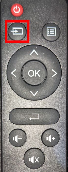 A photograph showing the input select button from the simple projector's remote.