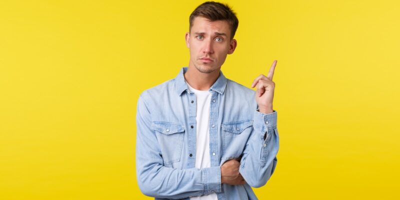 Serious Looking Raising Index Finger