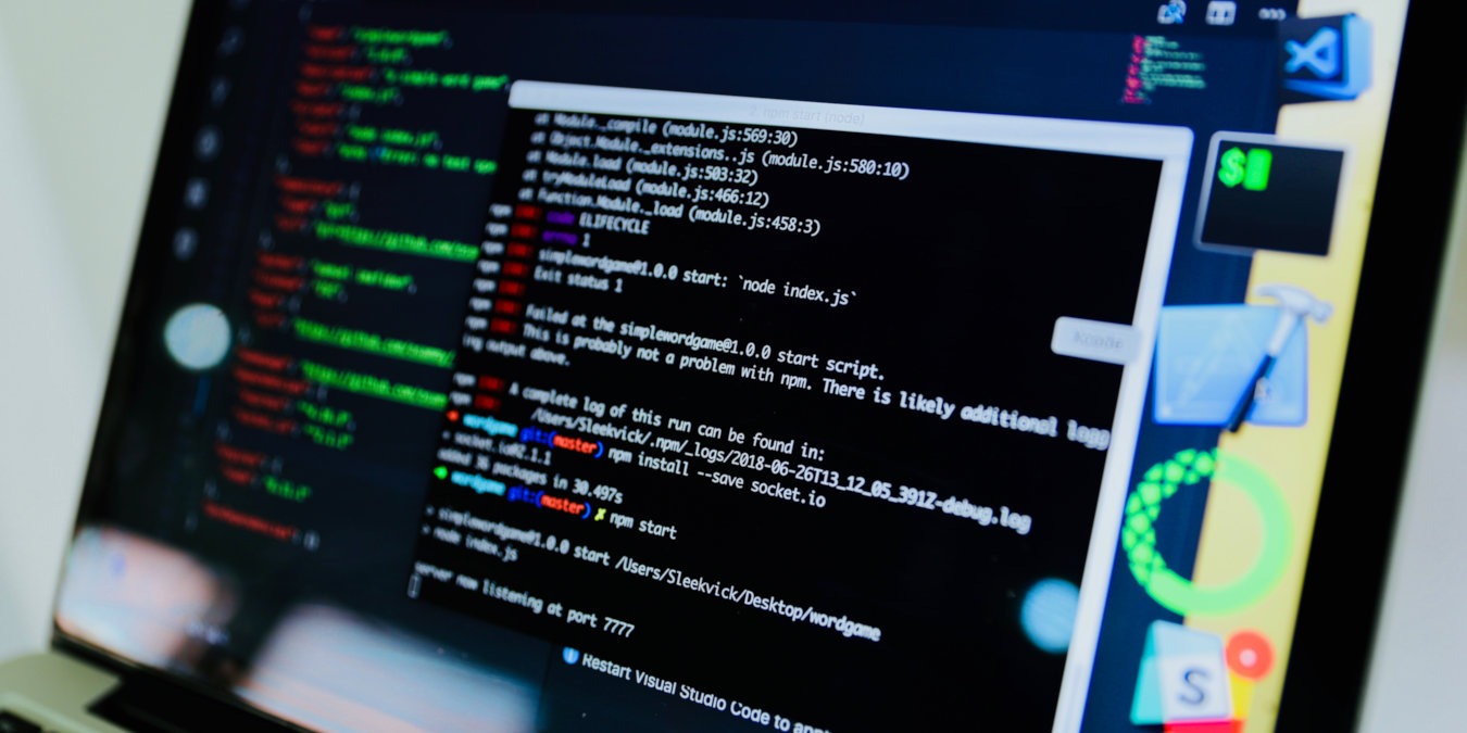 A photograph of a laptop's screen with programs running on it.