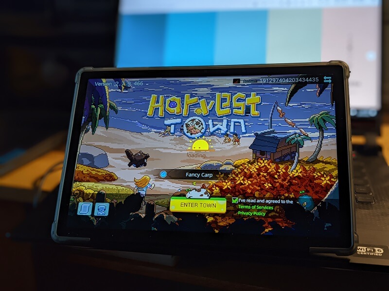 Loading Harvest Town game on tablet.