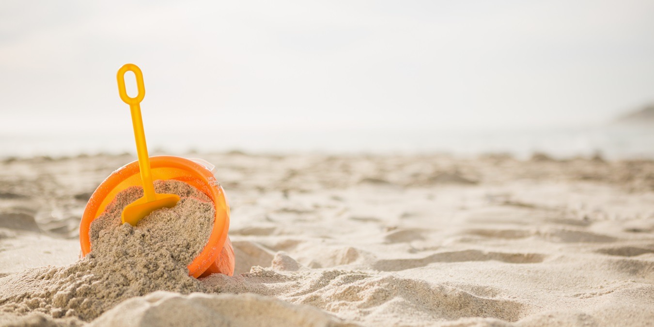 Bucket With Sand And A Spade On Beach