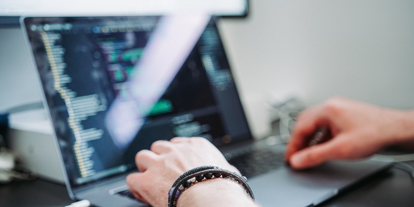 Close up of a person working on a laptop