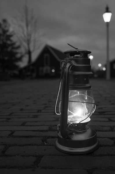Shot of a lamp on sidewalk with bokeh effect applied.