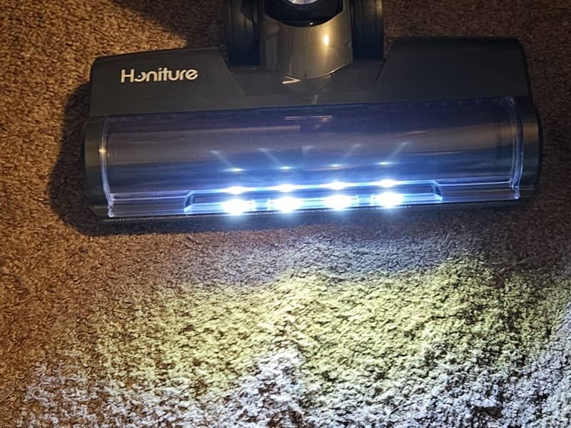 Honiture Cordless Vacuum Cleaner S14 with bright lights on carpet