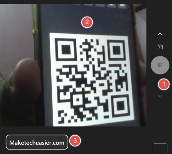 Using Windows Camera app to scan a QR code on a smartphone leading to a website. 