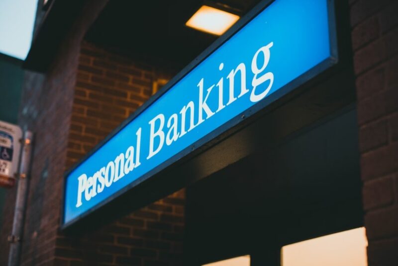 Personal banking sign above a door.