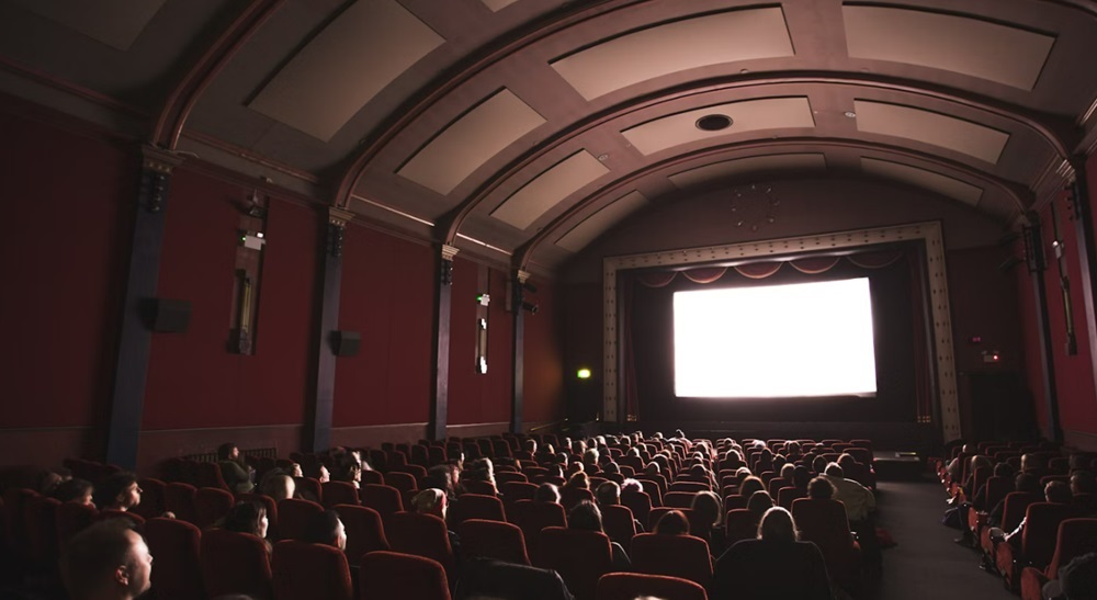 What Is a Nit of Screen Brightness, and How Many Do You Need? 10 Humans sitting in a film theater