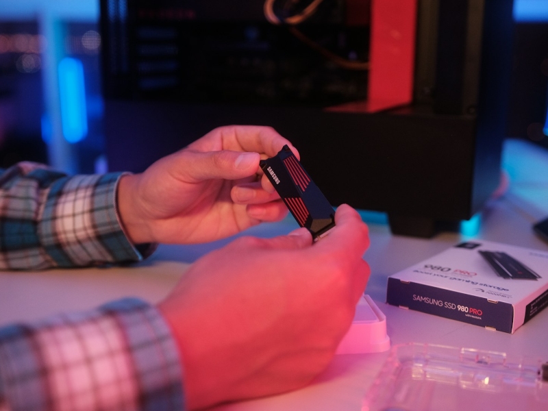 Person holding a Samsung SSD in their hand