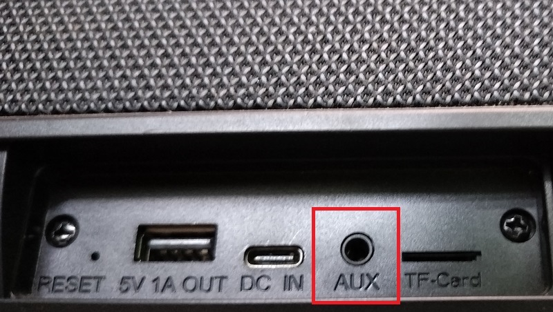AUX port visible on a Bluetooth speaker panel.