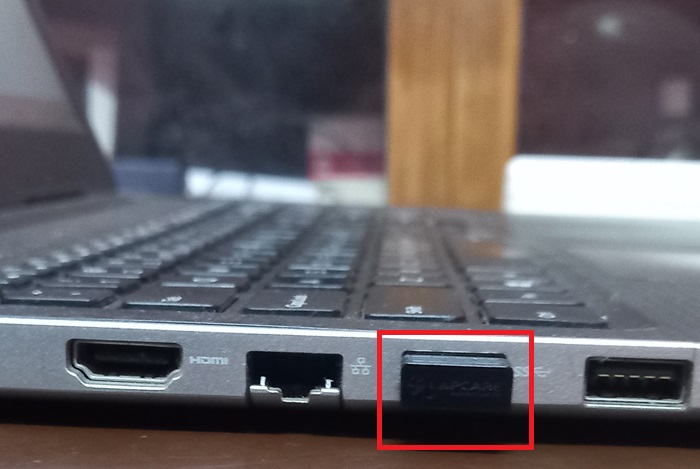 USB Bluetooth Adapter inserted in a laptop USB port for enabling Bluetooth functionality.