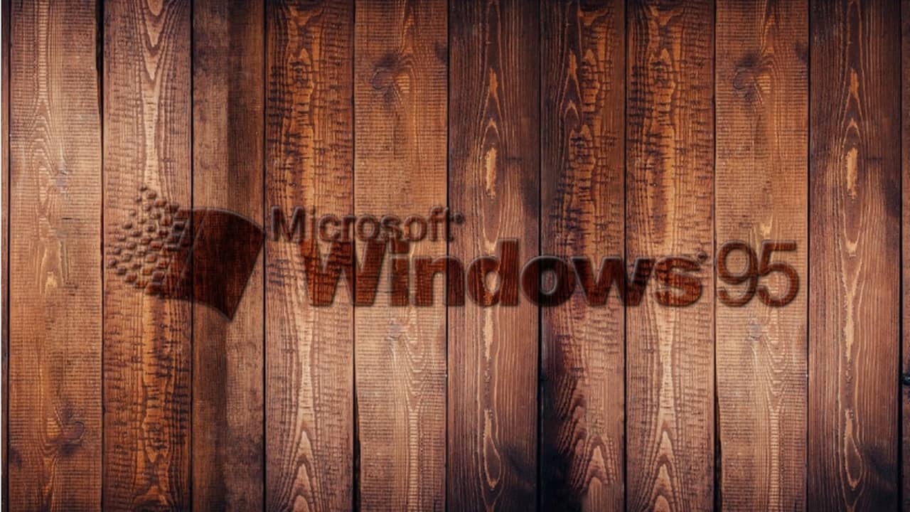 Windows 95 logo on a wooden background.
