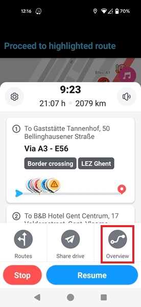 Checking route in Waze app with stop and Overview option visible.