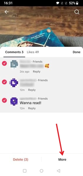 Tapping on More in TikTok app comments section after selecting comments.